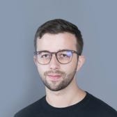 Joshua Zitser's face on a grey background