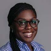 Jordan Hart's face on a gray background.